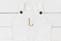 a white apron with an umbrella on it
