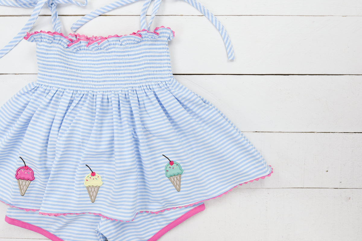 a blue and white striped dress with ice cream on it