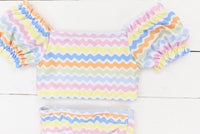 a baby girl's colorful outfit with ruffle sleeves