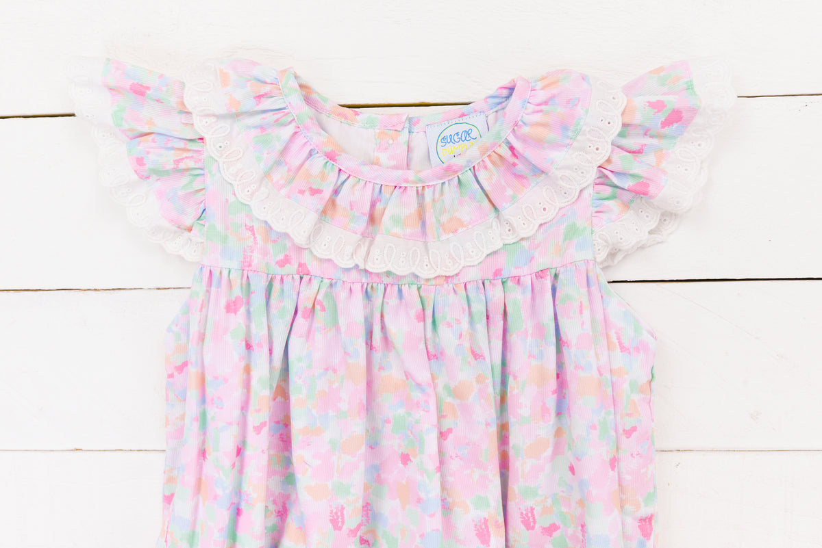 a baby girl's pink and blue floral dress