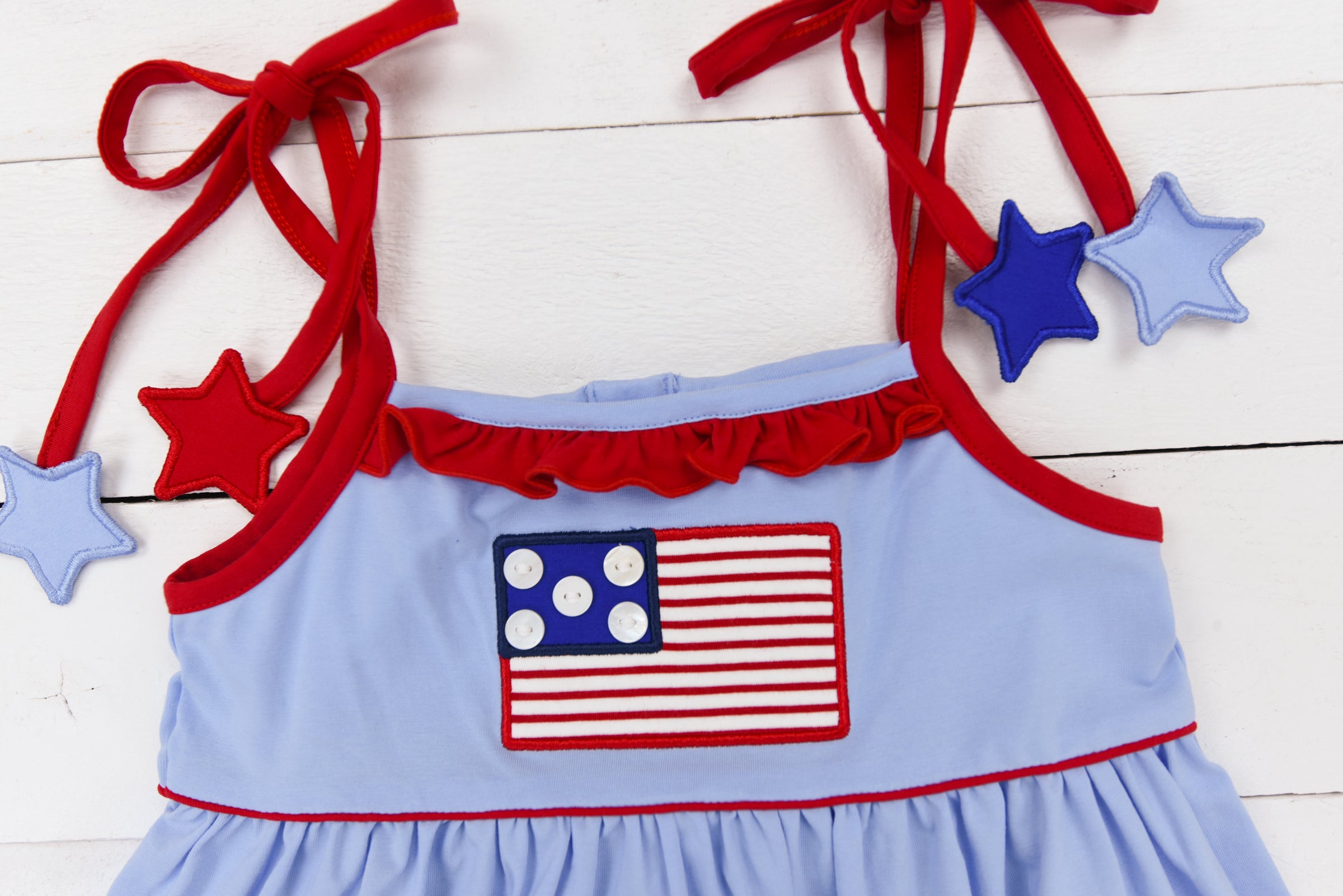 a blue and red dress with stars and a flag on it