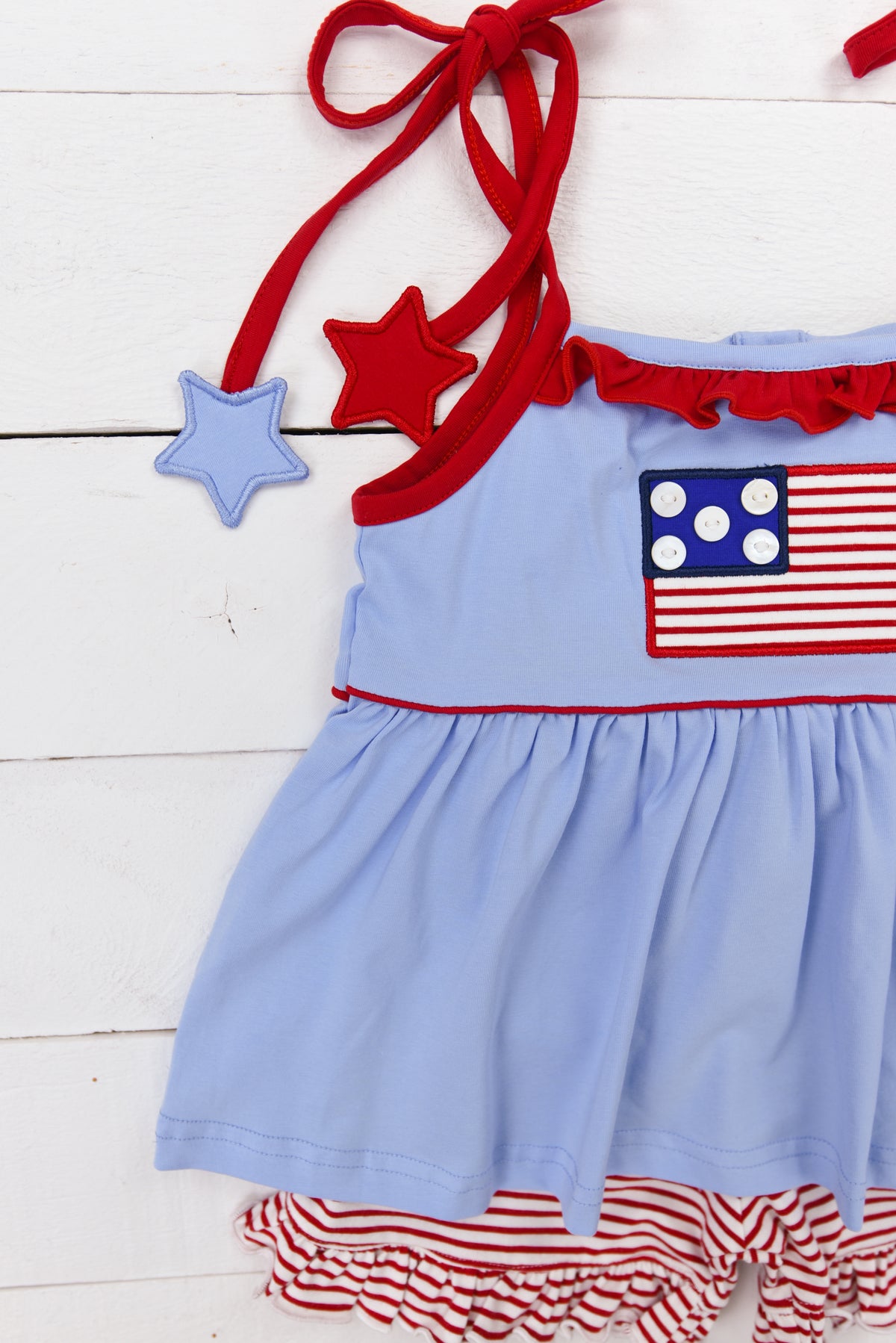 a blue dress with an american flag on it
