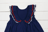 a blue dress with red, white, and blue trim